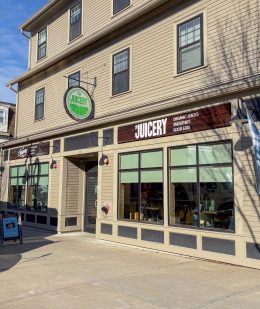 Exterior of The Juicery’s Durham (UNH) location with large front windows and Juicery signage.